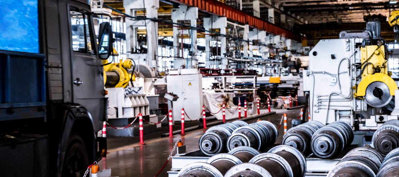 Industrial factory floor with machinery and metal coils